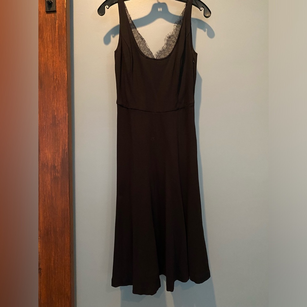 Classic black V-neck knee-length dress with lace detail